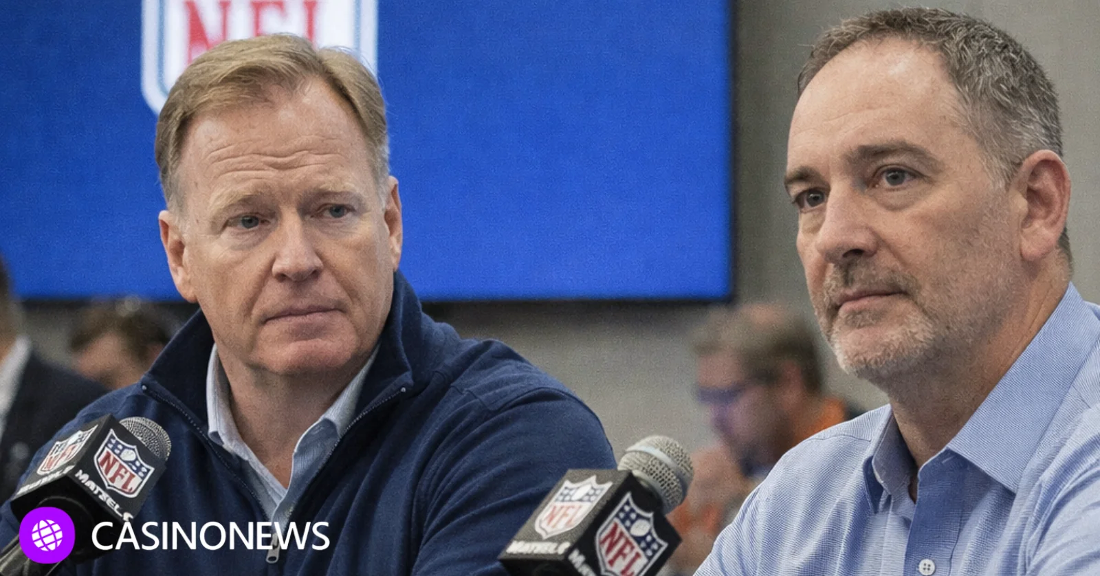 Two NFL executives speak at a press conference with microphones and the NFL logo visible behind them.