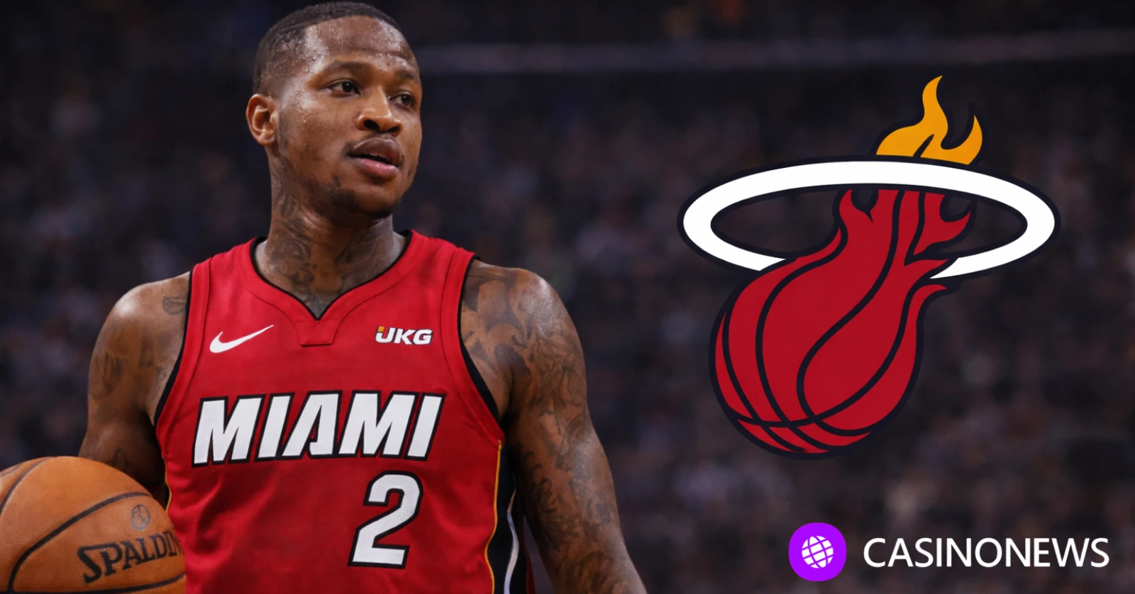 Miami Heat player holding a basketball on court with the Miami Heat logo shown on a dark blurred arena background