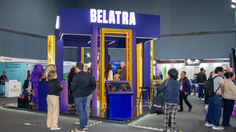 Belatra branded exhibition stand with visitors at international gaming industry trade event