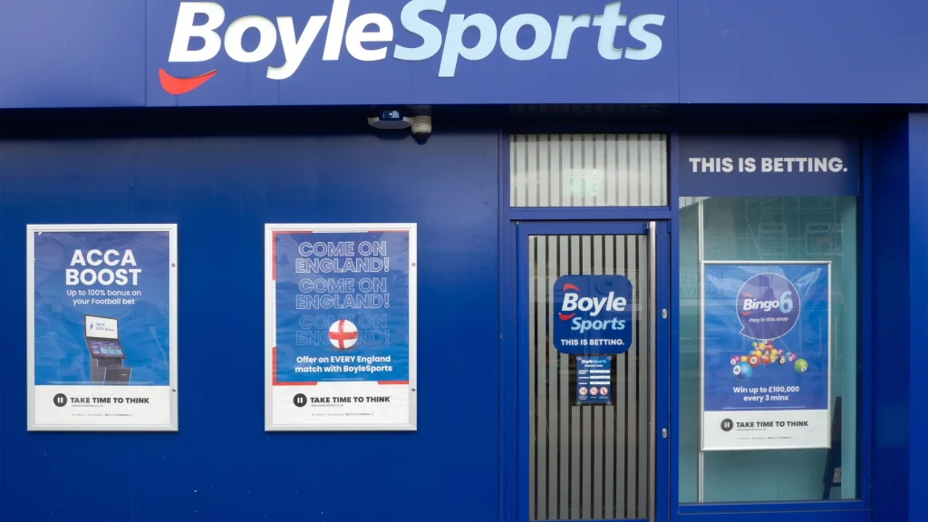 Front entrance of BoyleSports betting shop with sports betting promotional posters displayed outside