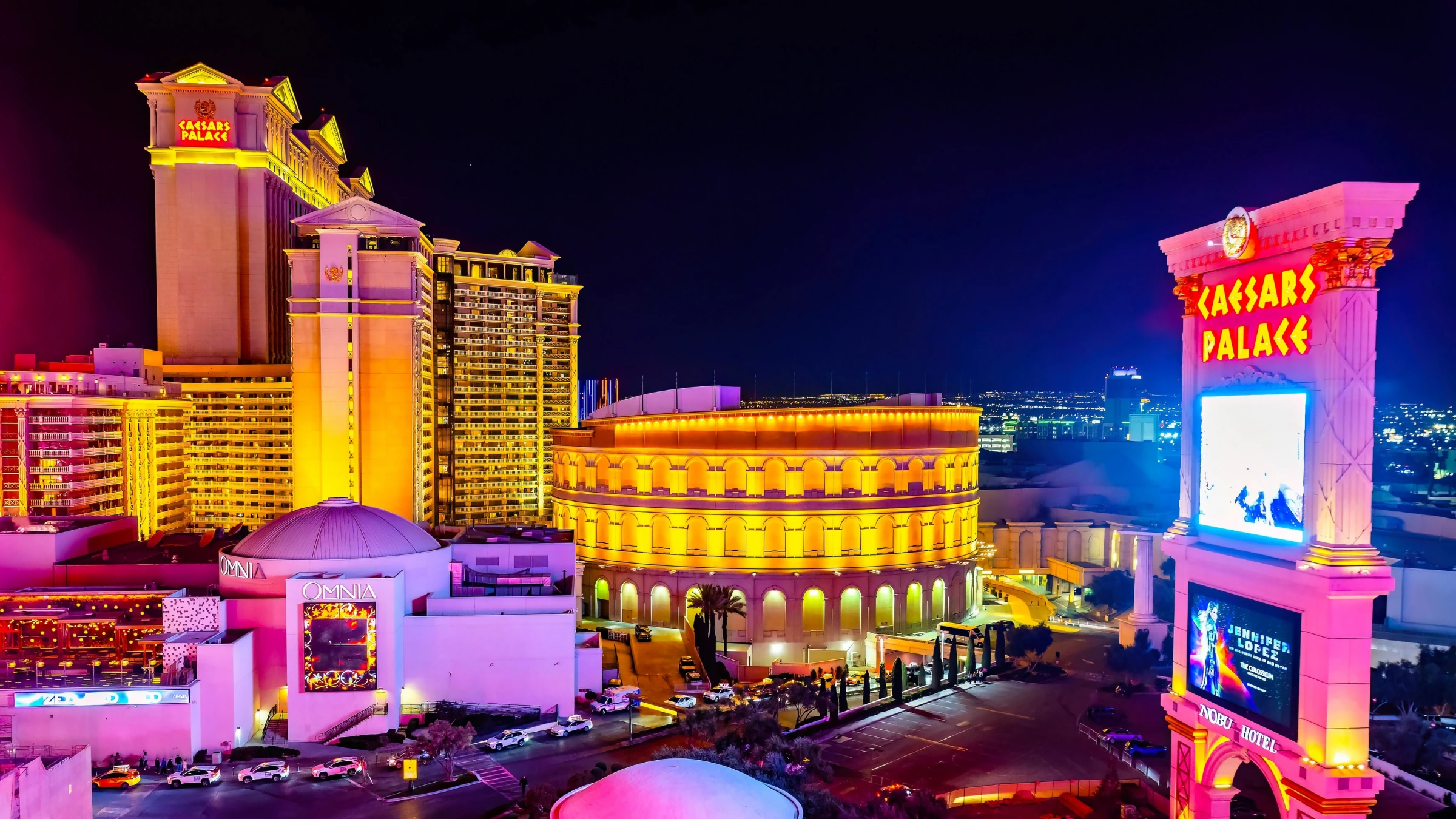 Caesars Palace hotel and casino illuminated at night in Las Vegas