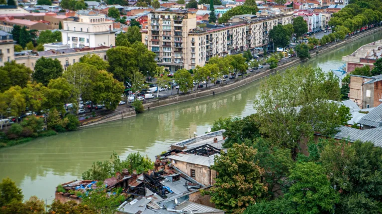 View of Tbilisi city canal and residential buildings linked to Georgia gaming market