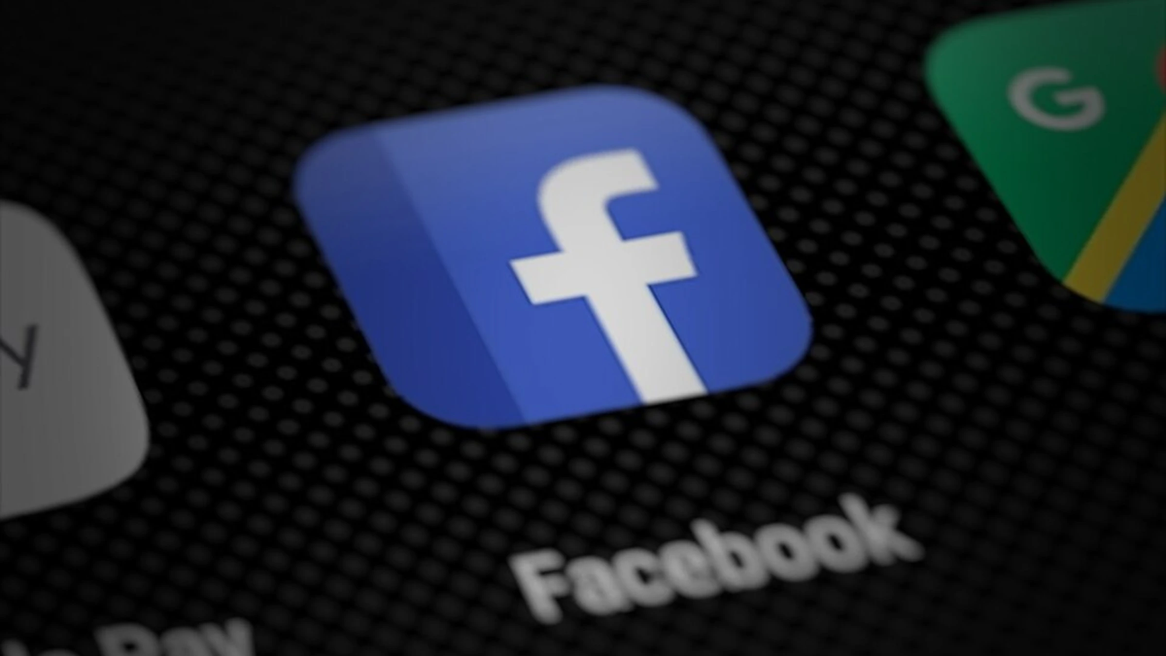 Facebook mobile app icon displayed on smartphone screen beside other social media applications