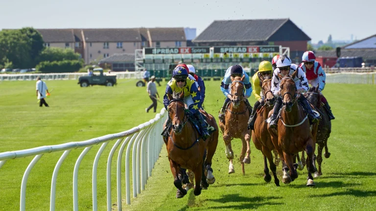 Horse racing competitors rounding track during discussion of wagering market changes