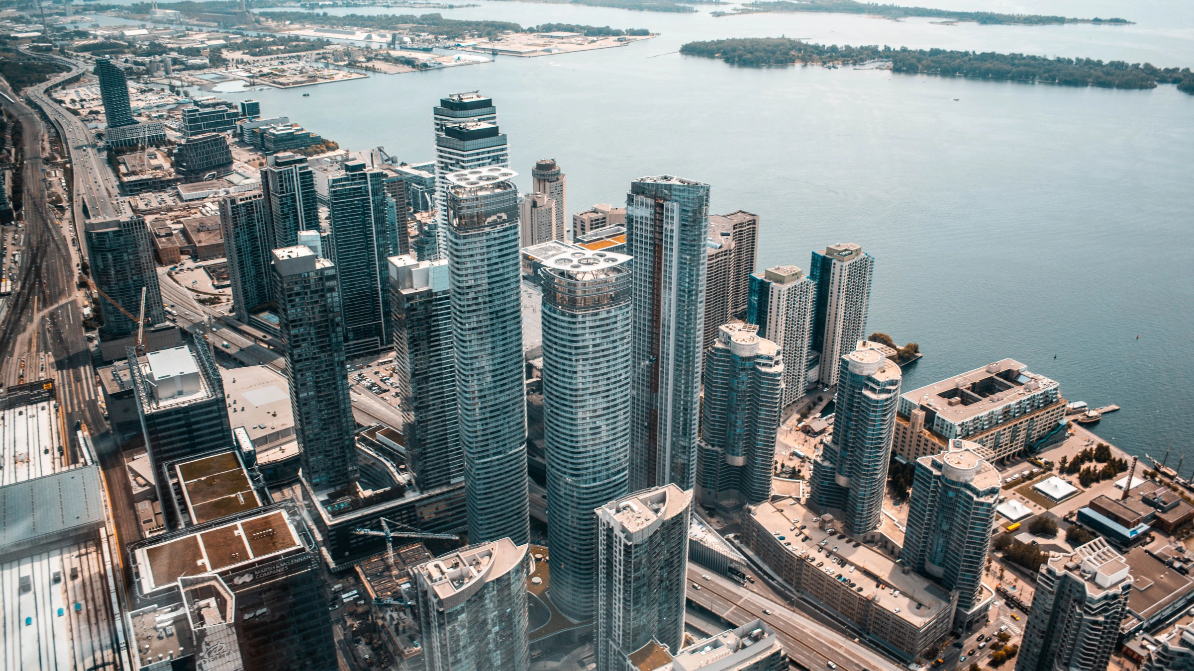 Aerial view of Toronto waterfront skyline with high-rise buildings beside Lake Ontario
