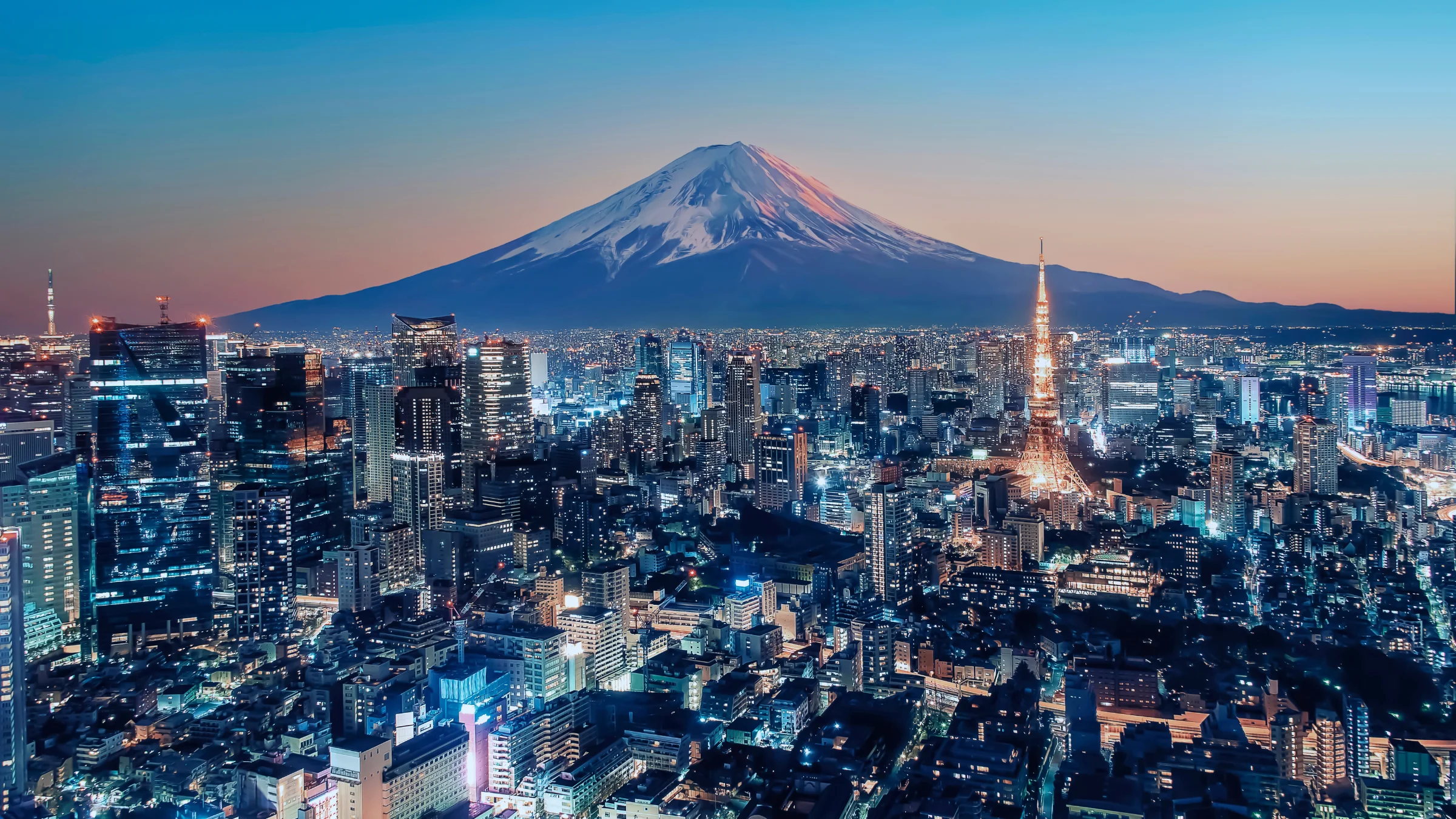 Tokyo skyline at dusk with Mount Fuji in the background, illustrating Japan’s crackdown on illegal online gambling.