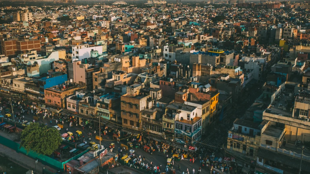 Dense urban neighborhood in India with crowded streets and low-rise buildings