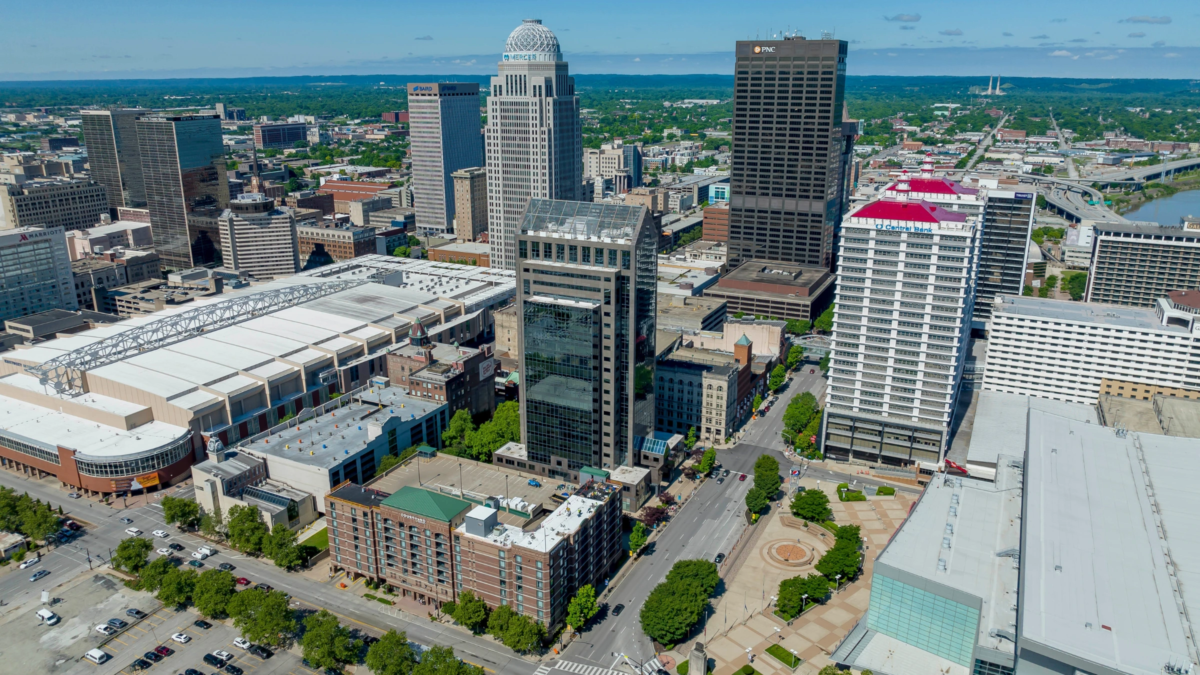 Aerial view of downtown Louisville skyline with office towers and city streets