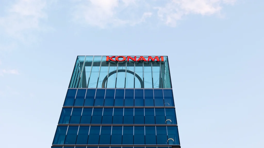 Konami corporate headquarters building with logo on glass tower