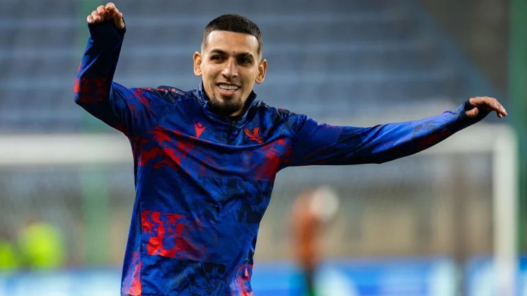 Football player warming up during training session before competitive match