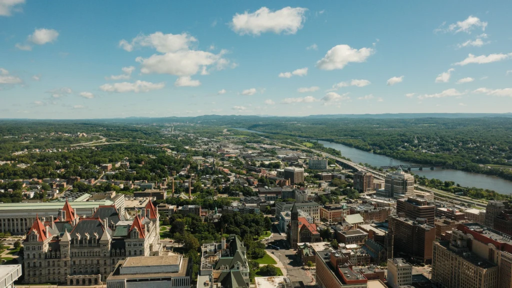 Aerial view of New York state government buildings and surrounding urban landscape