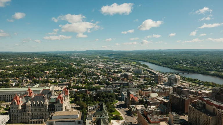 Aerial view of New York state government buildings and surrounding urban landscape