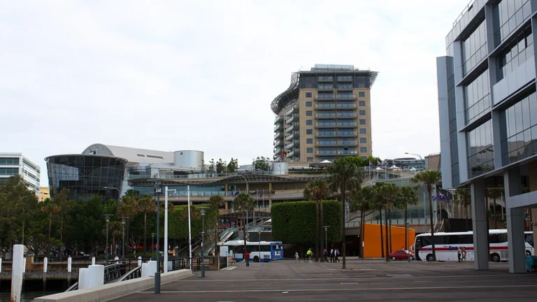Modern waterfront business district with commercial buildings, hotel and public promenade