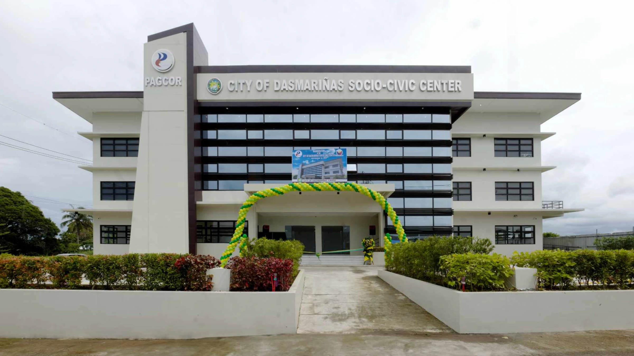 City of Dasmariñas socio-civic center building with PAGCOR signage at entrance.