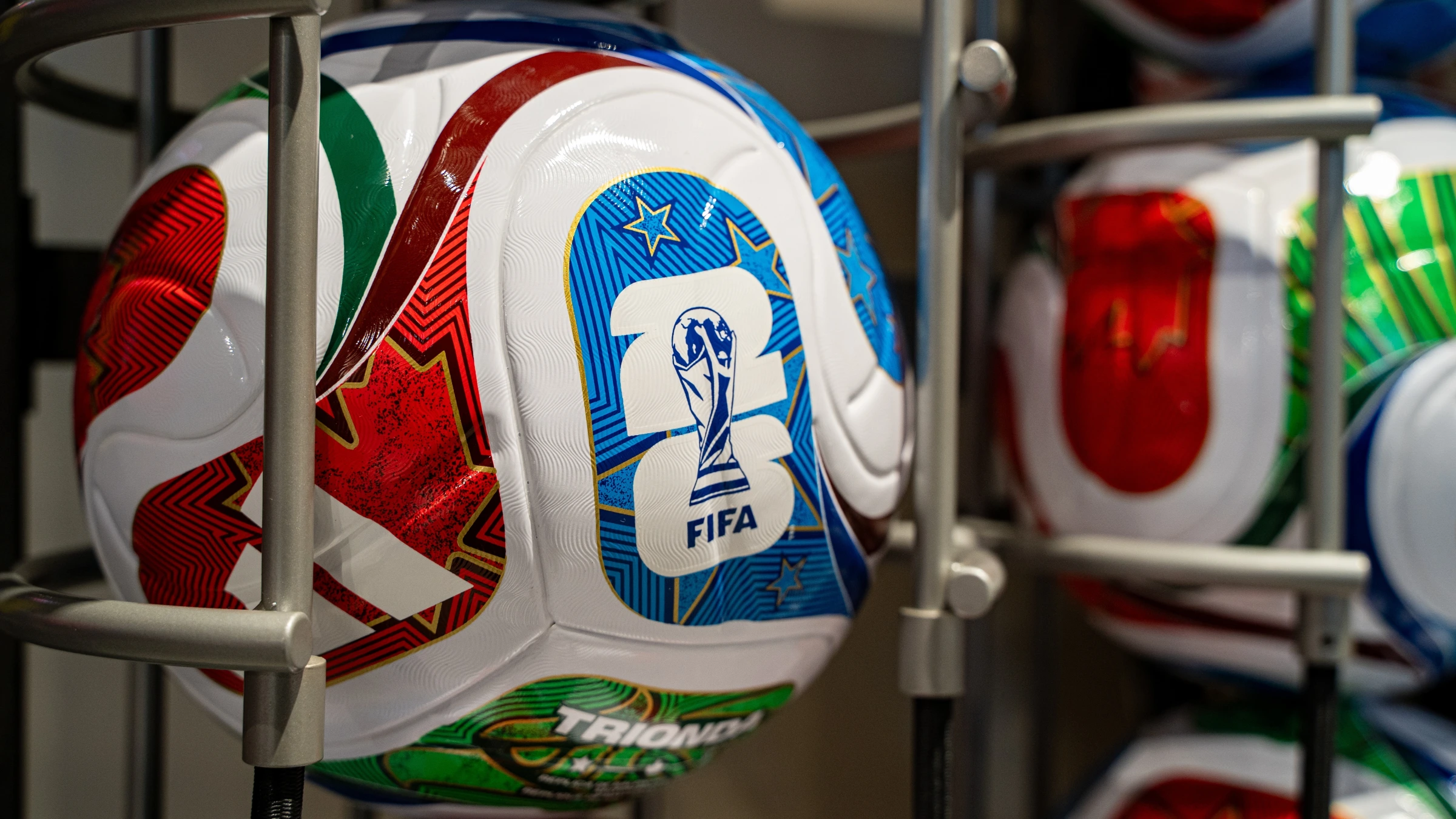 Official FIFA Club World Cup match balls displayed on a retail rack for sale