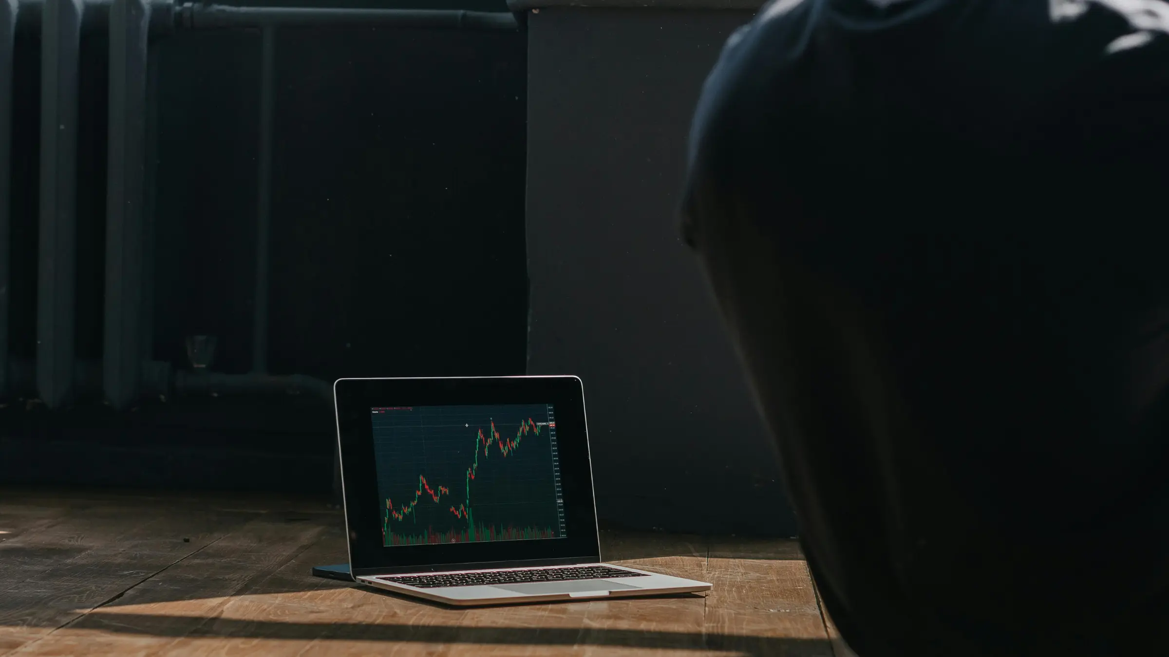 Trading chart displayed on laptop screen during market analysis session indoors