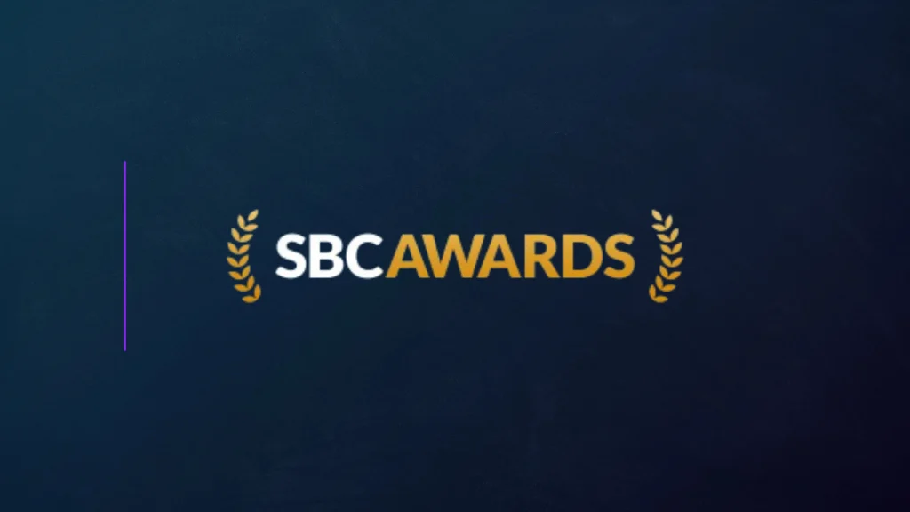SBC Awards logo with gold laurel wreaths on a dark blue background