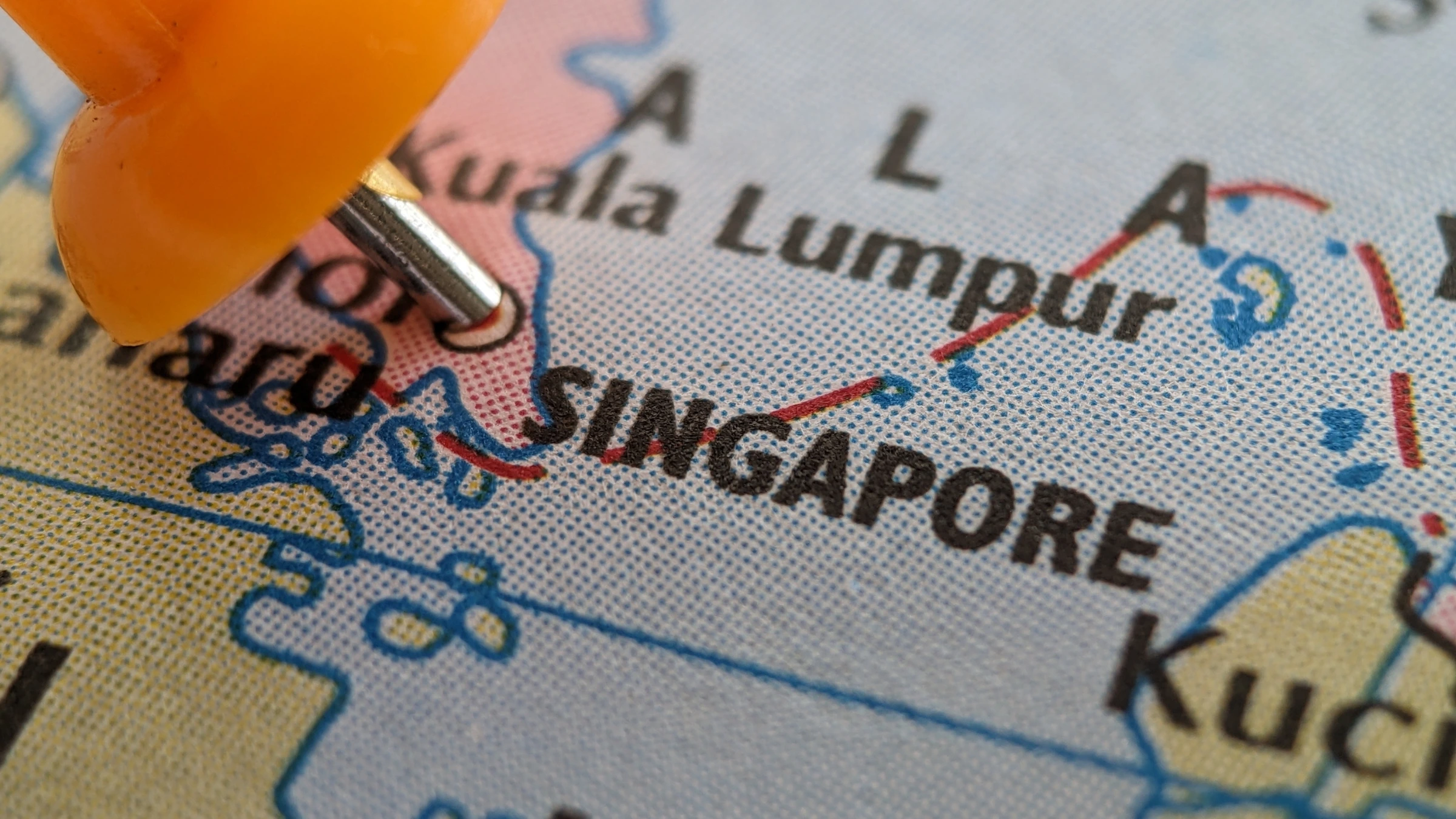 Close-up map showing Singapore location marked with orange pushpin in Southeast Asia