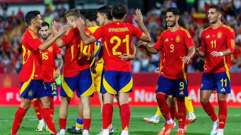 Spain national football team players celebrating together during an international football match