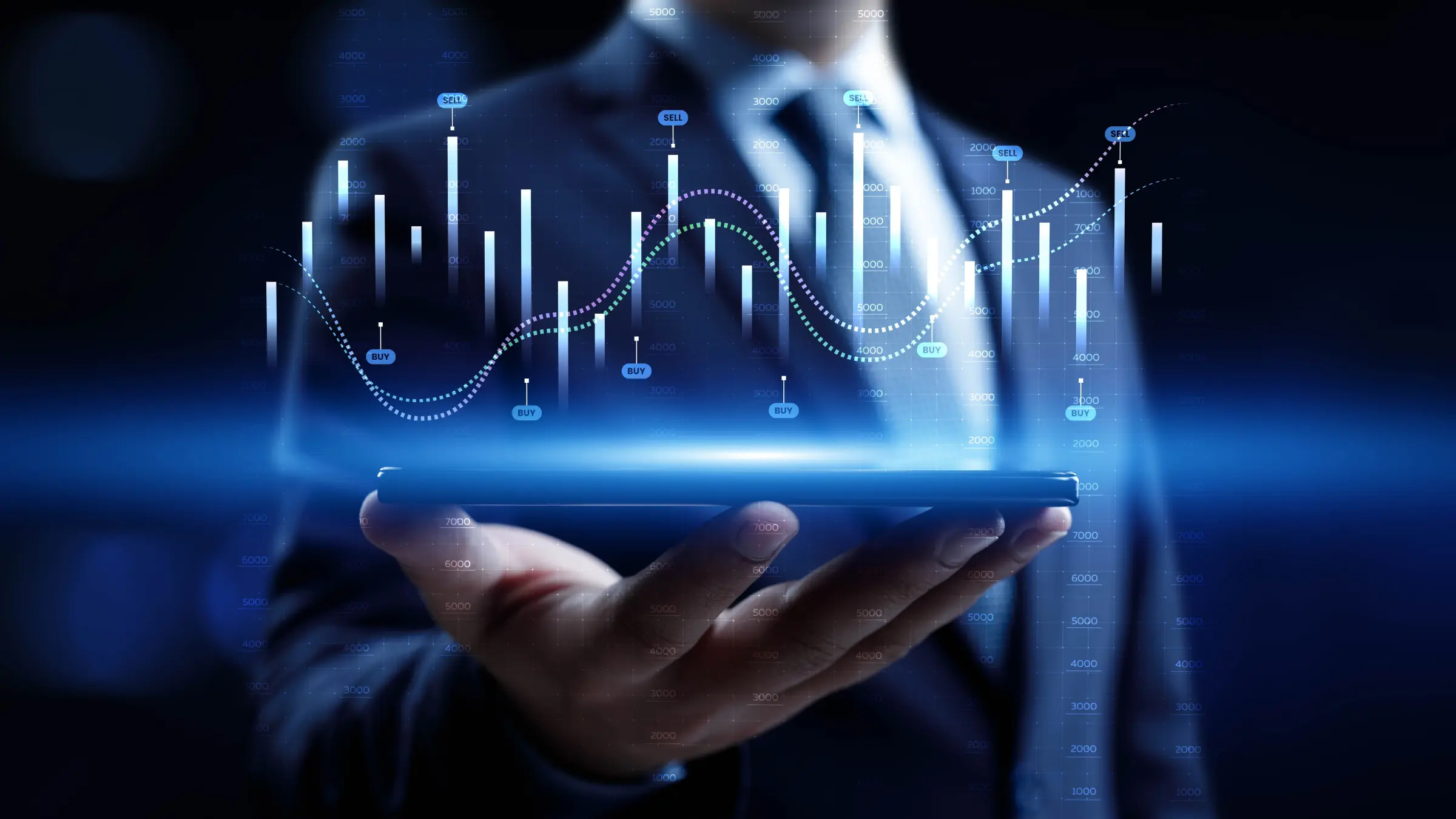 Businessperson holding digital tablet with glowing financial charts and market data graphics displayed