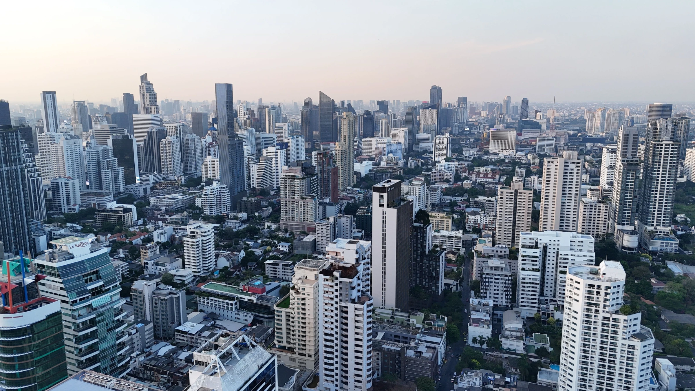 Panoramic view of Bangkok skyline with high-rise buildings and urban development