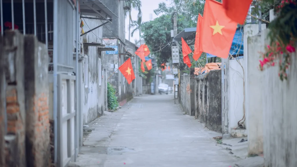 Vietnamese national flags lining street amid efforts to combat illegal gambling networks